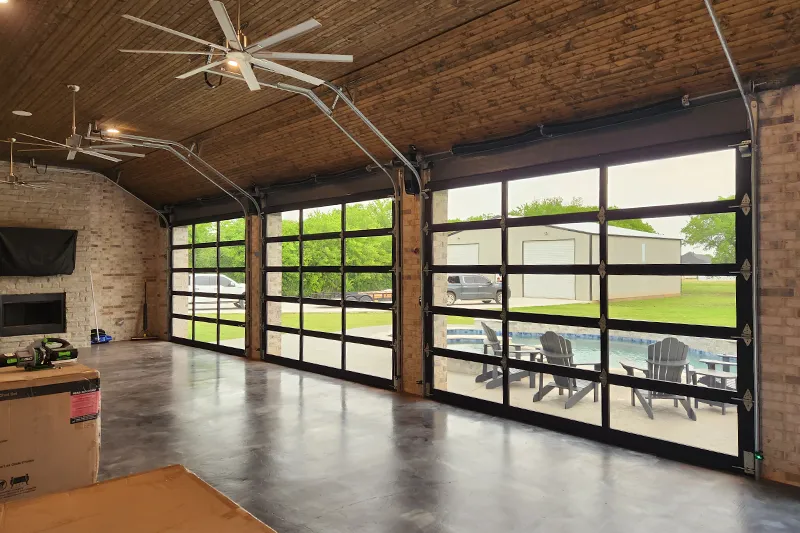 texas-garage-door-indoor Texas Garage Door - black anodized frame with ¼” bronze mirrorpane tempered glass